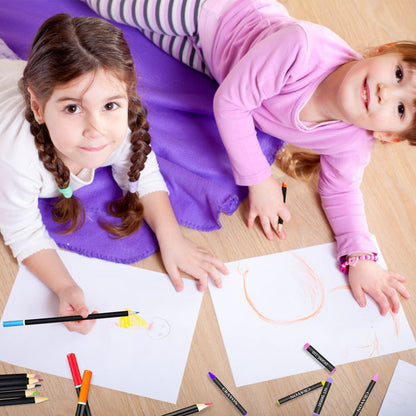 Girls drawing with colored pencils from the art set